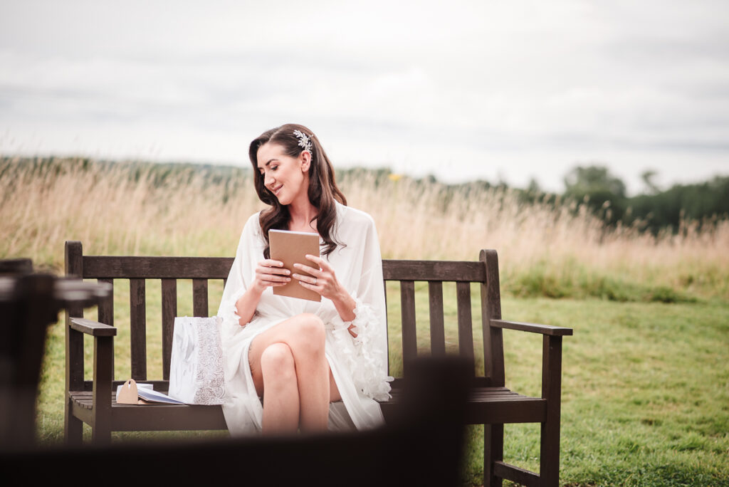 Bride enjoying gift from groom before the ceremony