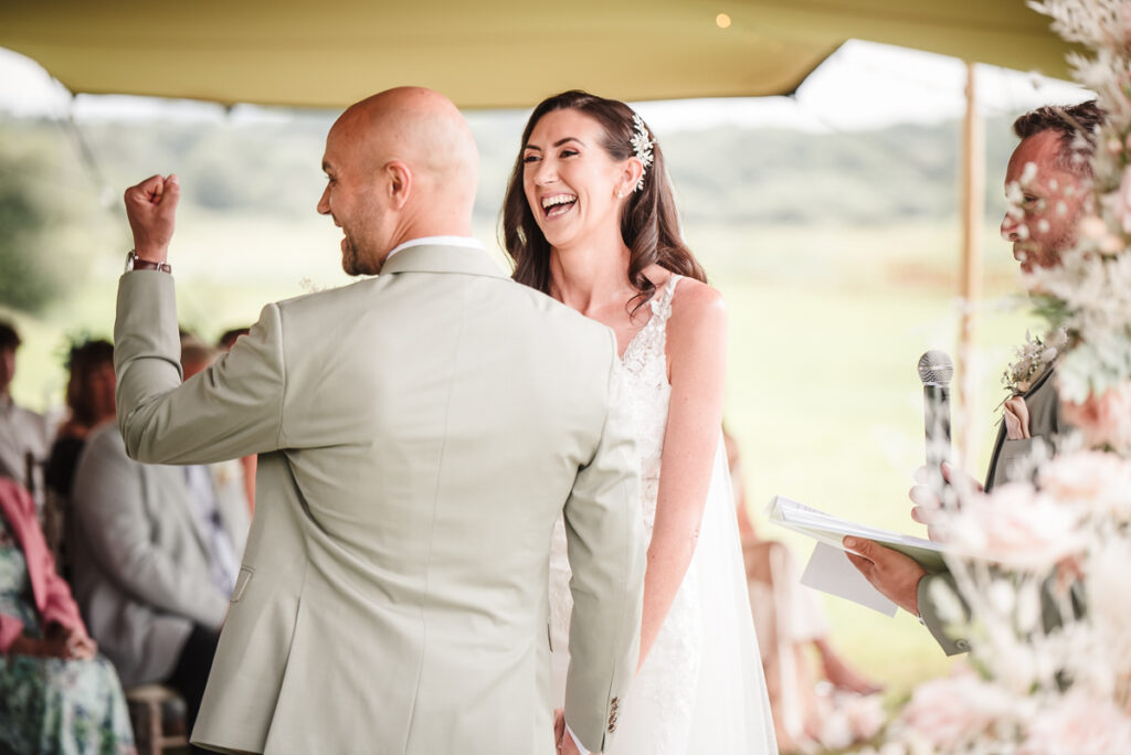 Bride and groom happy laughter during ceremony