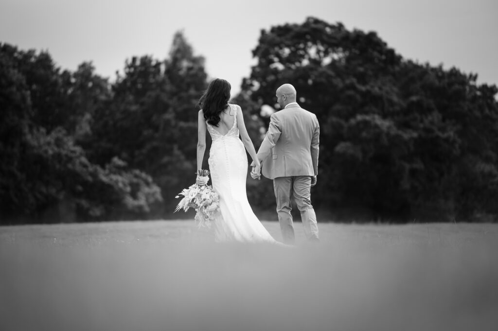 Bride and groom walking alone and enjoying their time during couple photos