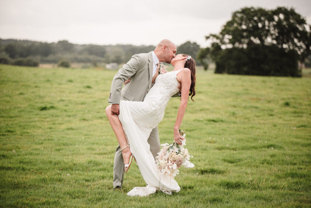 Bride and groom sharing an intimate kiss during their evening photo session