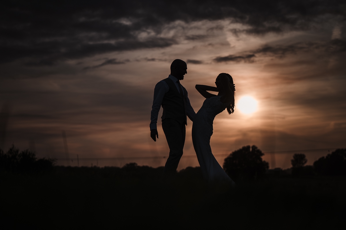 Bride and groom dancing during sunset at House on the Brooks