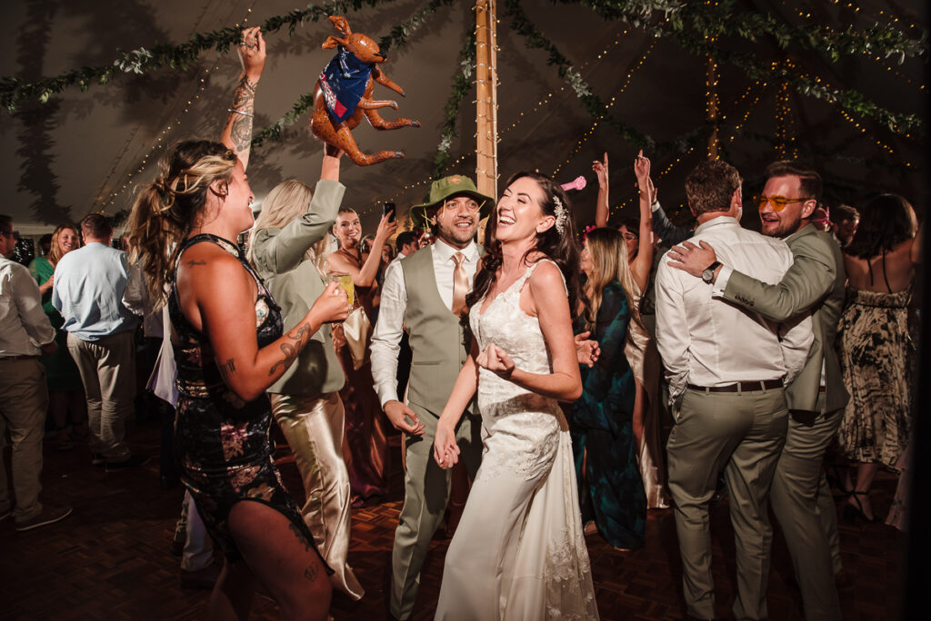 Bride dancing with guests on the dance floor