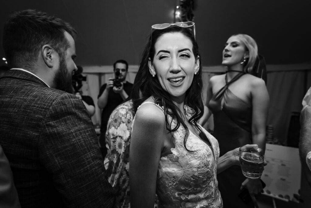 Bride winking at the groom on the dance floor