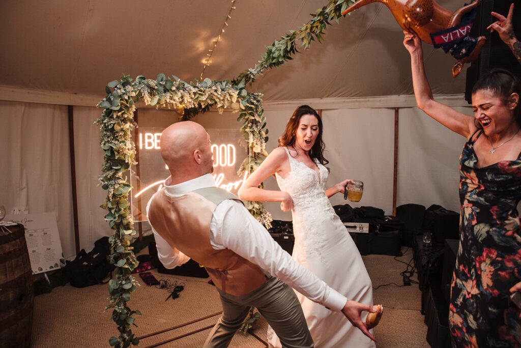 Bride and groom crazy energy during the party