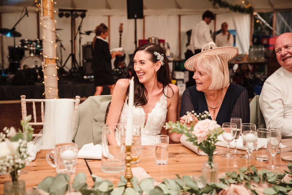 Bride's reaction during the groom speech at their DIY wedding at House on the Brooks